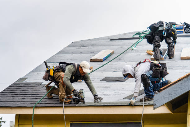 Professional Gutter Installation technician working in Ashburnham, MA